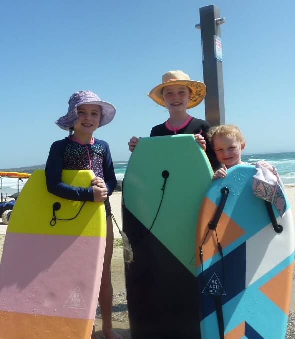 Fun in the sun: Poppy, Daisy and Holly Catarinich enjoy time at Town Beach while the beachside shower is still working. 