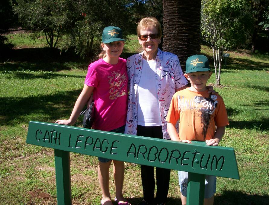 Cath Le Page (centre) with Jacinta and Hugh Sharp at the renamed arboretum. Photo: Friends of Kooloonbung Creek Nature Park