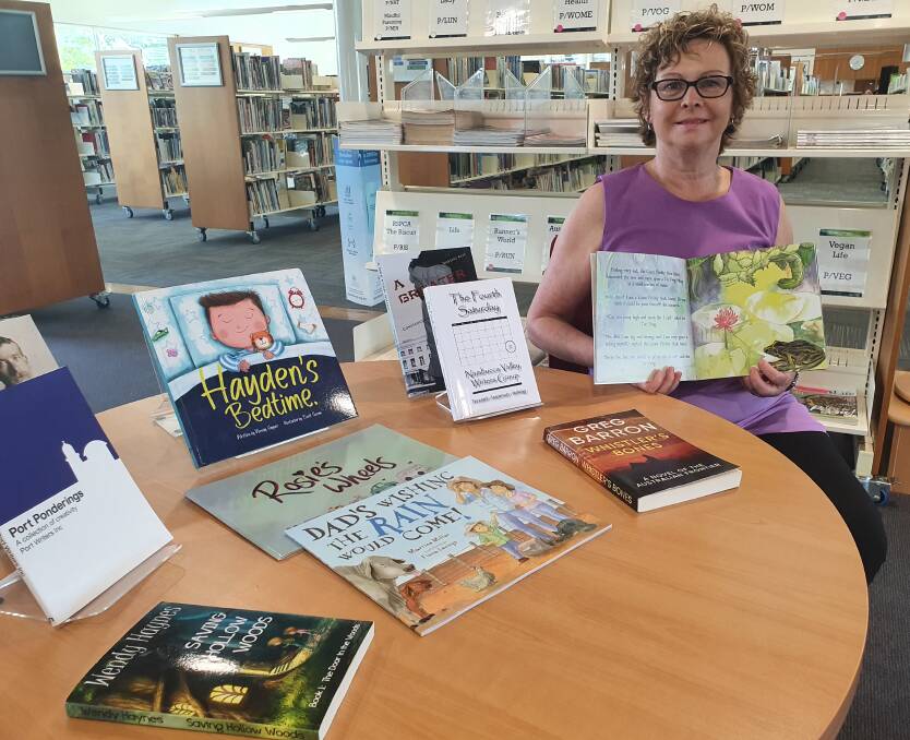 Creative talents: Mid North Coast Writers' Centre president Wendy Haynes showcases books written by local authors.