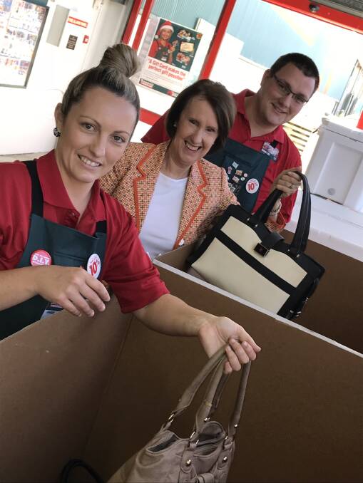 Christmas campaign: Bunnings Port Macquarie operations manager Amber McCalister, Port Macquarie MP Leslie Williams and Bunnings Port Macquarie store manager Jacob Andriessen support the It's in the Bag campaign.