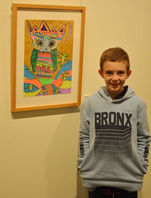 Well done: Abe Whitfield is proud of his primary category winning artwork titled “Magical Owl”.
