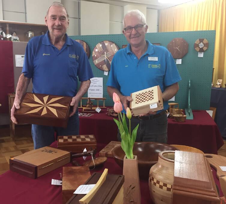 Hastings Woodworkers Guild president Graeme Ditchburn and vice-president Rod Hoare help out at the exhibition and sale.