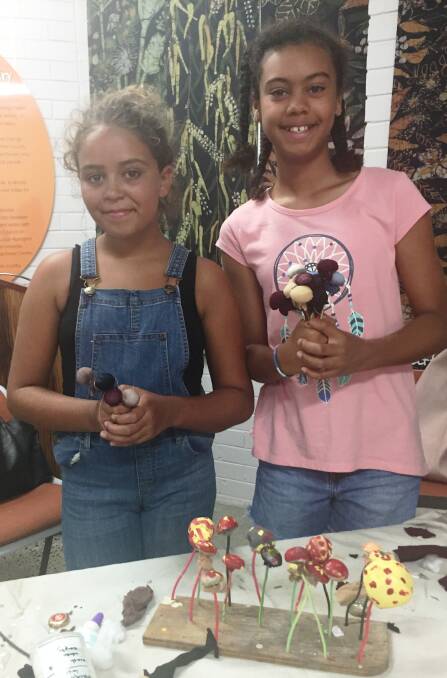 Environmental awareness: Shayla Wooderson and Mya Armah turn household waste into mushrooms during the Frugal Forest school holiday workshop.