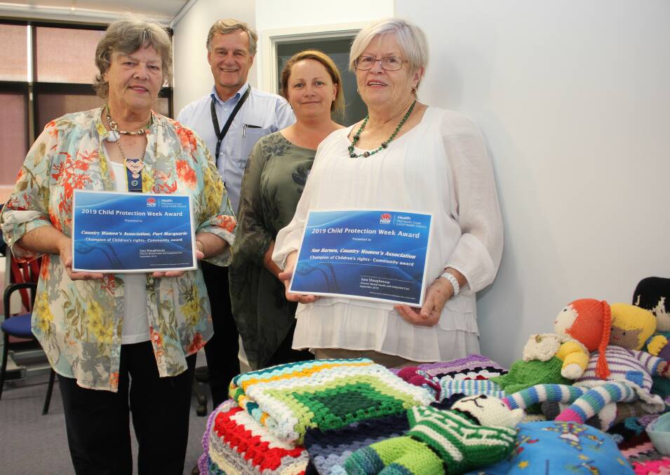 Congratulations: Marilyn Brown and Sue Barnes from the Port Macquarie CWA Branch with director of paediatrics Dr David McDonald and acting district coordinator Out of Home Care and youth health Ruth Reynolds at the award presentation.