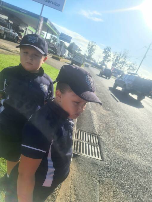 Long walk: Loghan Spier and his sister Monique Spier negotiate a section without a footpath on their way to school. Photo: Supplied