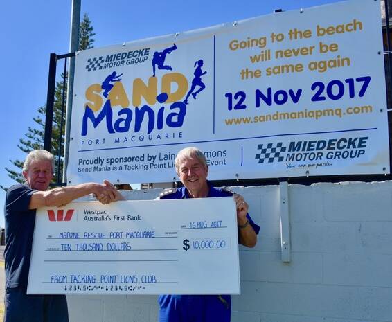 Community ties: Tacking Point Lions Club's Rob Bruce presents funds from the 2016 event to Neil Yates from Marine Rescue Port Macquarie.