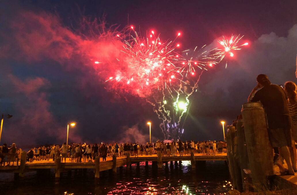 Community celebration: Residents and visitors pack Port Macquarie's foreshore to watch the fireworks display on New Year's Eve.