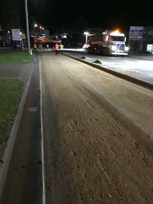 Roadwork: Road resurfacing takes place at night in Jindalee Road. Photo: Port Macquarie-Hastings Council