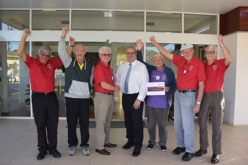 Generous gesture: Port Macquarie Lions Club president Ian Turner (third from left) thanks Garden Village chief executive officer Craig Wearne with support from Gerald Billing, Carl Lockwood, Brian Langley, John Howley and David Sherrard.