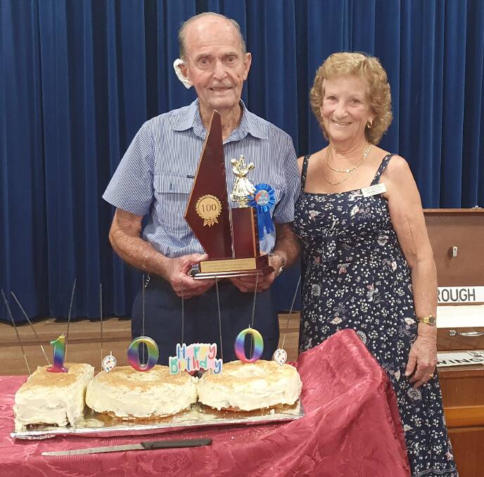 Congratulations: Arthur Dixon accepts a trophy to celebrate his 100th birthday from Senior Citizens Club president Marjorie Utley.