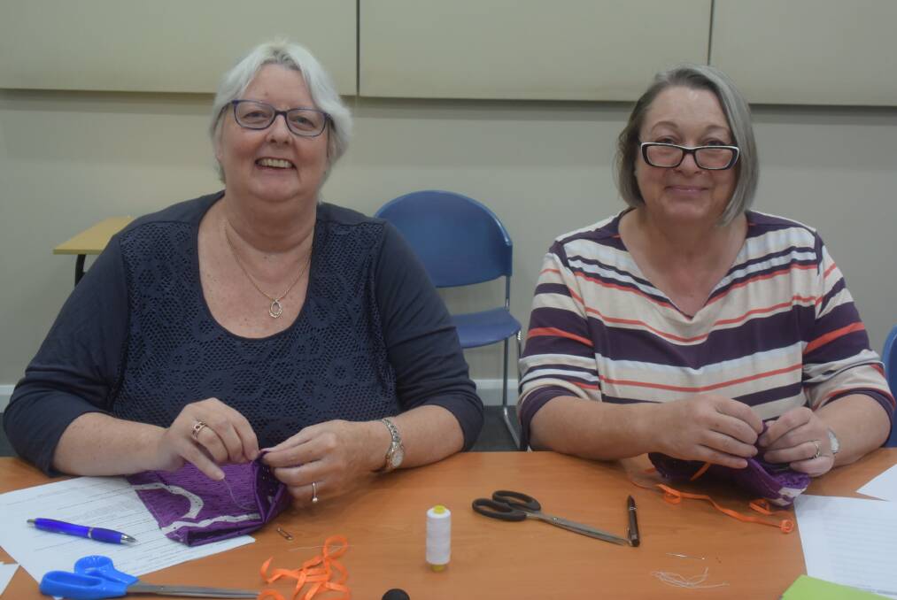 Minimise waste: Julie Adams and Janet Cooke make reusable fruit and vegetable bags during the Choose to Reuse workshop.