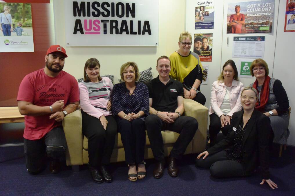Team effort: Mission Australia chief executive officer James Toomey (fourth from left) meets with Port Macquarie staff members John Talamaivao, Karen Quinn, Kellie Ansell, Robyn George, Bev Bernard, Robyn Richardson and Nicole Rowe.