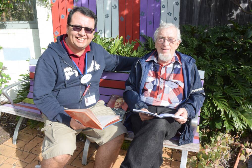 Literary interest: Support worker Daniel Riveros and client Jim Crombie delve into some poetry books.