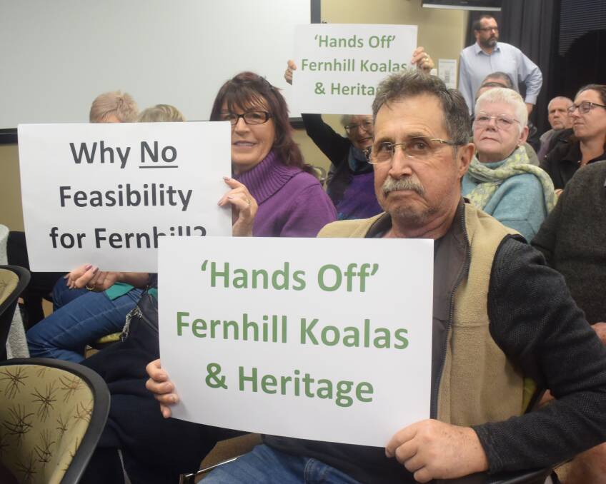 In the crowd: Residents make their position clear at the council meeting.