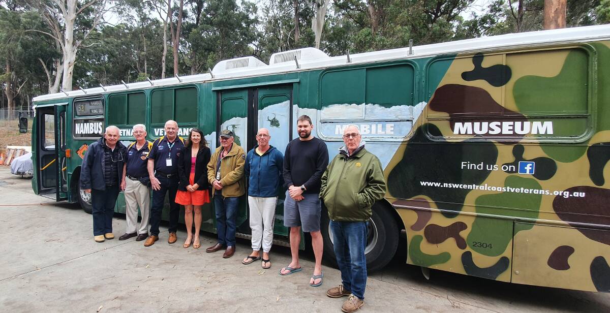 Mobile museum: Ian Johnson, Barry Lynch, Peter Goldsmith, Cr Sharon Griffiths, Lindsay Thomson, Phil Dewhurst, Cam Smith and Kerrin Brown gather outside the Nambus after attending a lunch at the Veteran Support Centre.