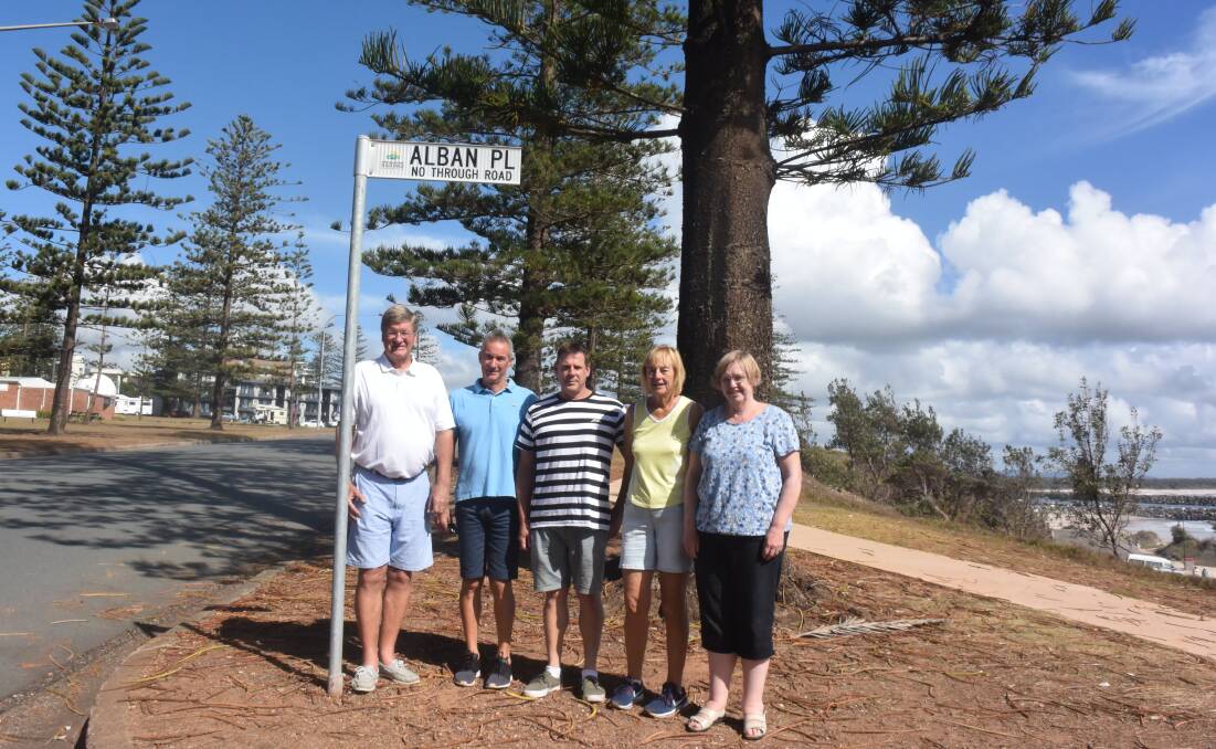 Sign of respect: David King (centre) and four of Alban Elliot's grandchildren Peter Thomson, Ian Thomson, Gill Homan and Lynette Godden talk about Alban Elliot's contribution to Port Macquarie.