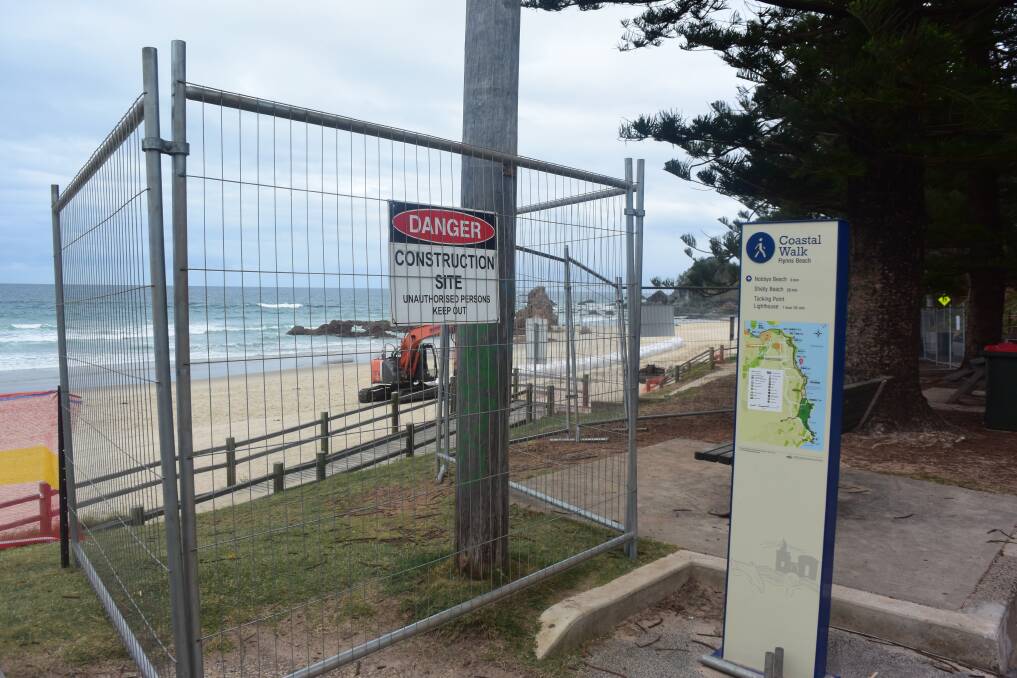 Fencing has gone up at Flynns Beach as the construction of a seawall begins.