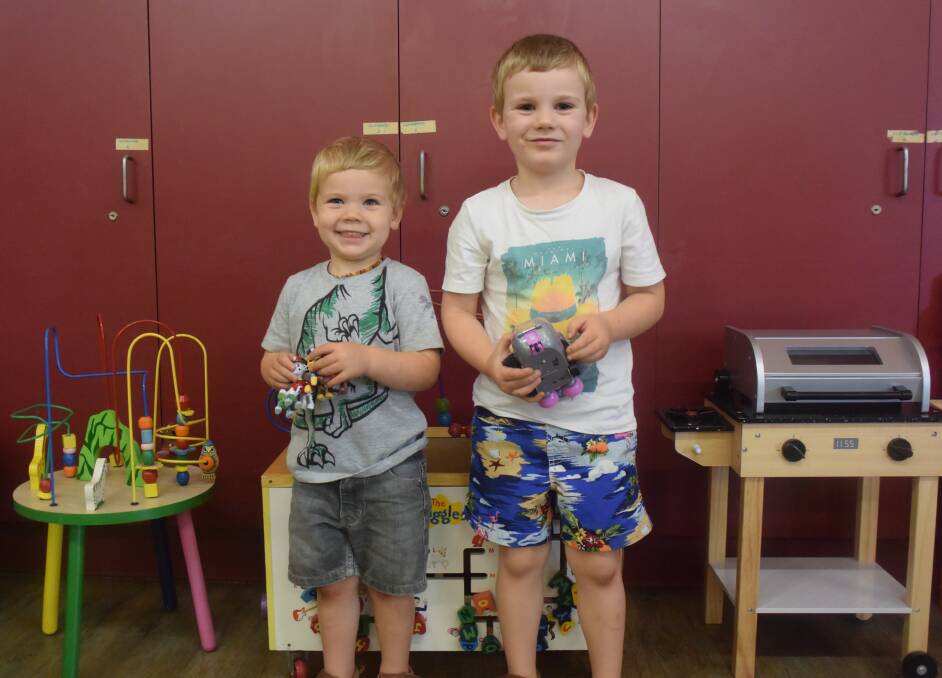 Child's play: Josiah and Elisha Gullick are fans of Port Macquarie Toy Library.