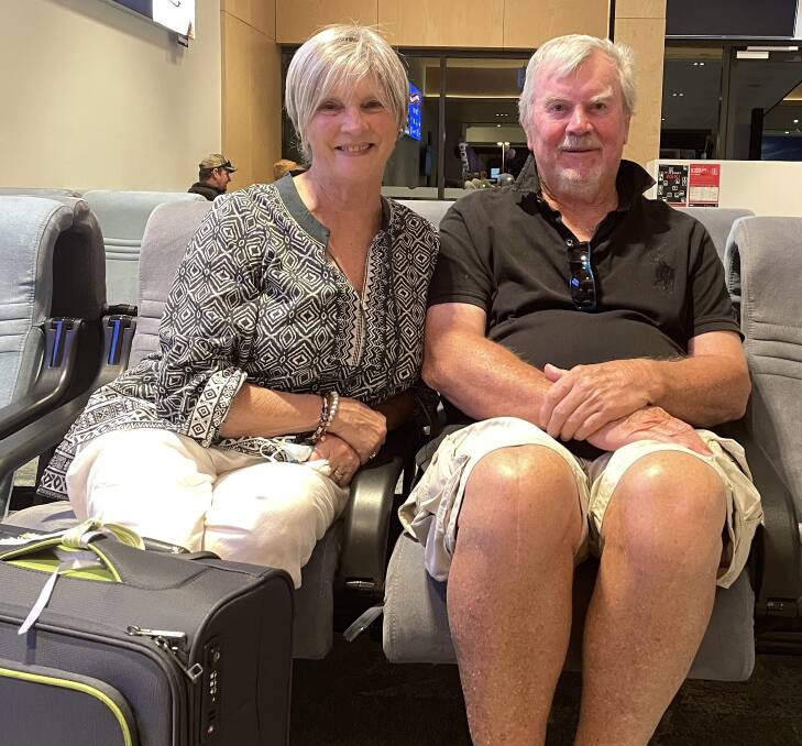 Allison and John Adamson get ready to board the flight to the Sunshine Coast. Picture by Lisa Tisdell