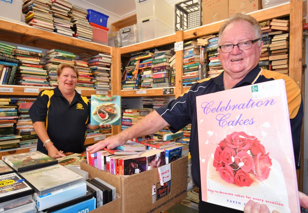Books galore: Elizabeth Fielding and Ray White get ready for the Giant Book Sale. An estimated 40,000 to 50,000 donated books will be on offer over three days at Port Macquarie Panthers. Photo: Ivan Sajko