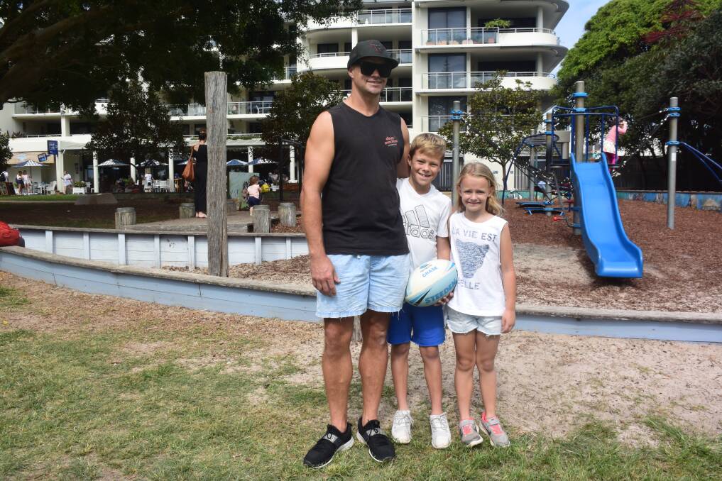 Family time: Sydneysiders Ash Tozer and Chase and Bella enjoy the Town Green.