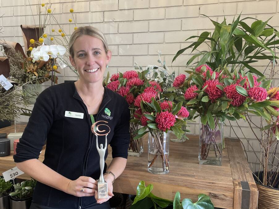 Touchwood Flowers owner Ashley Sargeson displays the trophy for the Australian Women's Small Business Champion Awards florist category. Picture by Lisa Tisdell