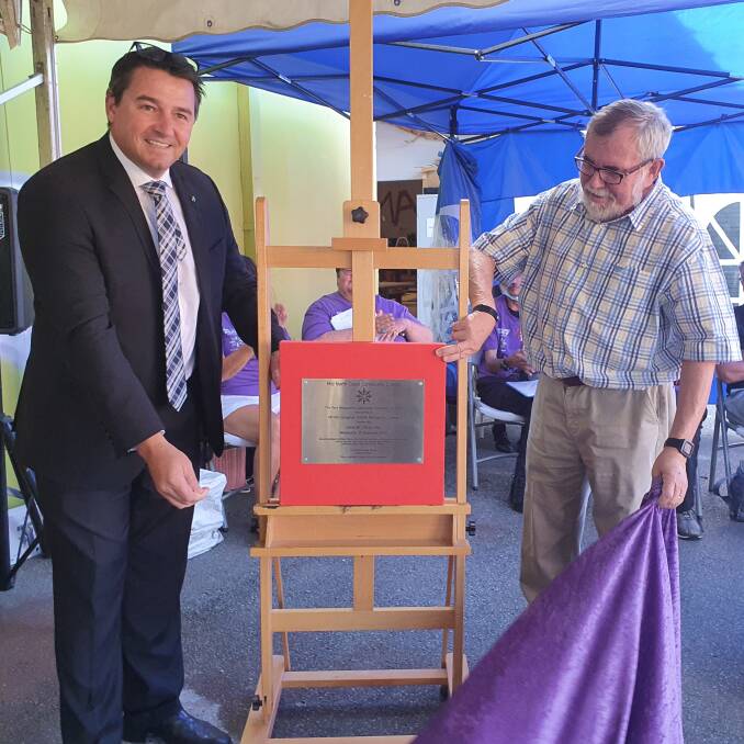 Milestone: Cowper MP Pat Conaghan and board chairman Grant Burtenshaw unveil the plaque at the community education precinct's official opening.