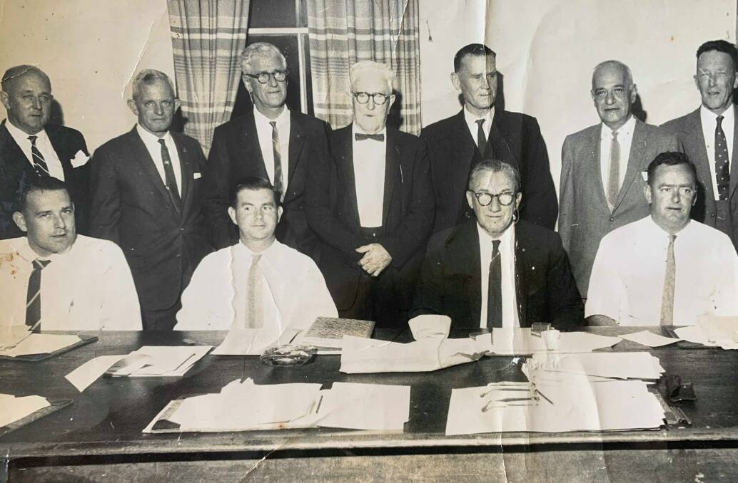 Bill Alcock (seated second from left) as the town clerk, pictured with council employees, the mayor and aldermen.