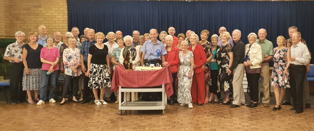 Arthur Dixon joins Port Macquarie Senior Citizens Club members to celebrate his 100th birthday.