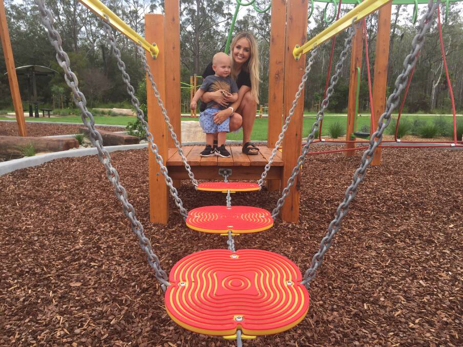 Great park: Laura Abbott and one-year-old Kobe test out the play equipment at Crestwood Park.