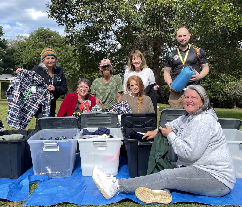 Port Macquarie-Hastings Homelessness Committee members Deb Tougher, Alex Wade, community participant Jack Brown, committee members Elle Wilkins, Kerry Etherington, at back, Chris Mauler and Tracey Rogerson, seated, with some of the donated items at the Homelessness Week travelling roadshow. Picture by Lisa Tisdell