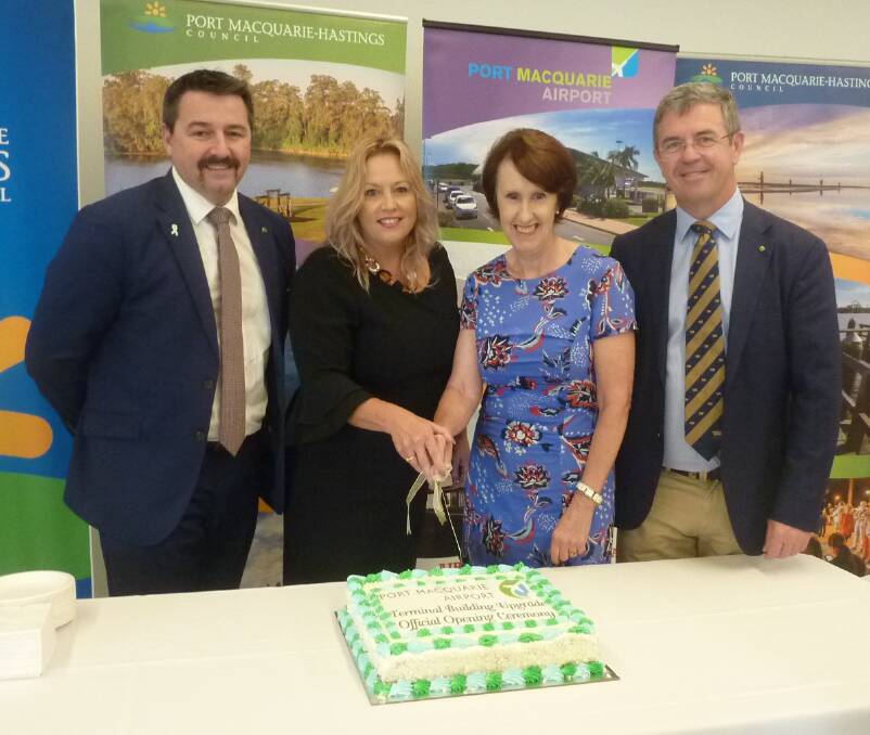 Celebration: Mayor Peta Pinson and Port Macquarie MP Leslie Williams cut the cake to mark the airport terminal upgrade's official opening as (left) Cowper MP Pat Conaghan and (right) Lyne MP Dr David Gillespie look on.