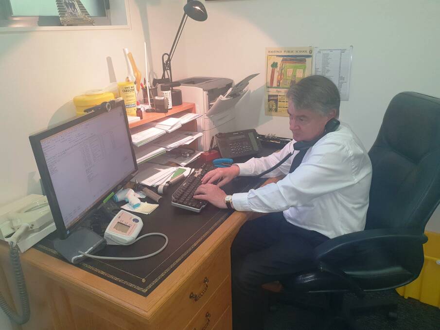 Continuous care: Greenmeadows Medical practice principal Dr Robert Clarke prepares for a telehealth consultation.