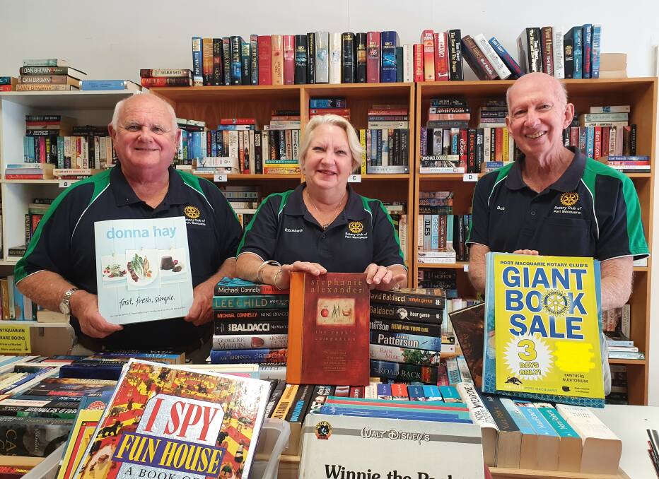 Books galore: Rotary Club of Port Macquarie community service director Phil Perry, president Elizabeth Fielding and book sale coordinator Bob Cleland support the Giant Book Sale.
