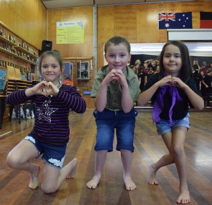 Creative expression: Zarhli Wilkinson, Jaxon Pacoe and Isobelle Bendt get ready for the performance.