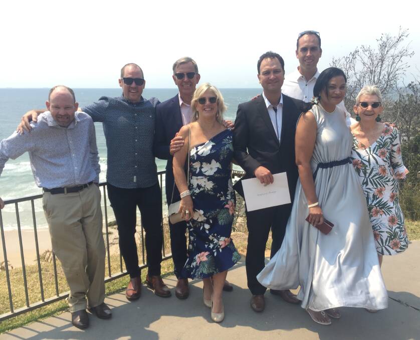 Making memories: Mark Markey, Ross Haydon, Frank and Katrina Garen, Dave and Kelly Markey, (back) John Mylonas and Maureen Dowdell gather at Harry's Lookout after the wedding.