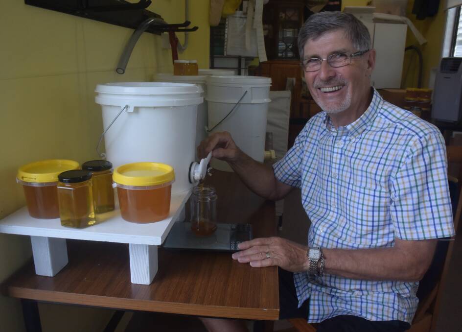 Sweet success: Hastings Valley Amateur Beekeepers Association president Charles Watkins decants some honey.
