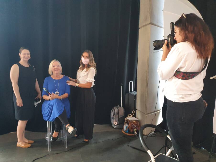 Looking ahead: Artist Kim Staples (second from left) prepares to have her photo taken by Natalie O'Donnell (right) as council's Amanda Hatton and The Style Vibe's Vanessa Lawrence look on.