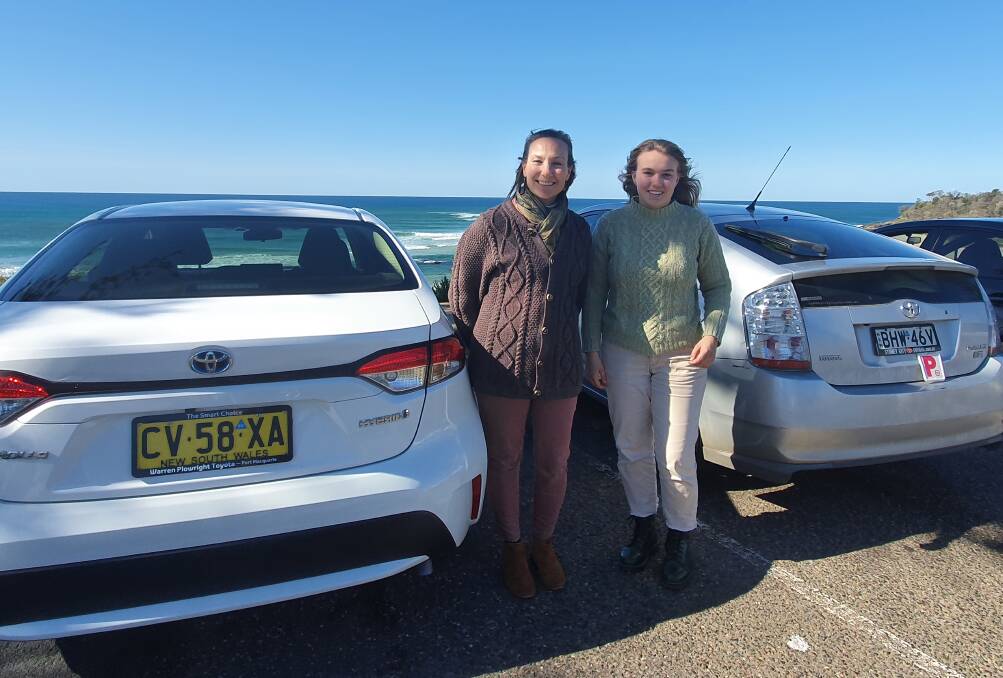 On the road: Veterinarians for Climate Action founding board member Dr Angela Frimberger and her daughter Ivy Moore both drive hybrid cars.