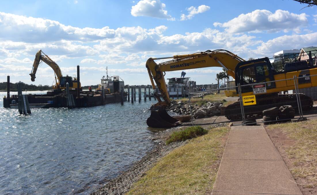 Heavy machinery is in place as work begins to construct the commercial wharf.