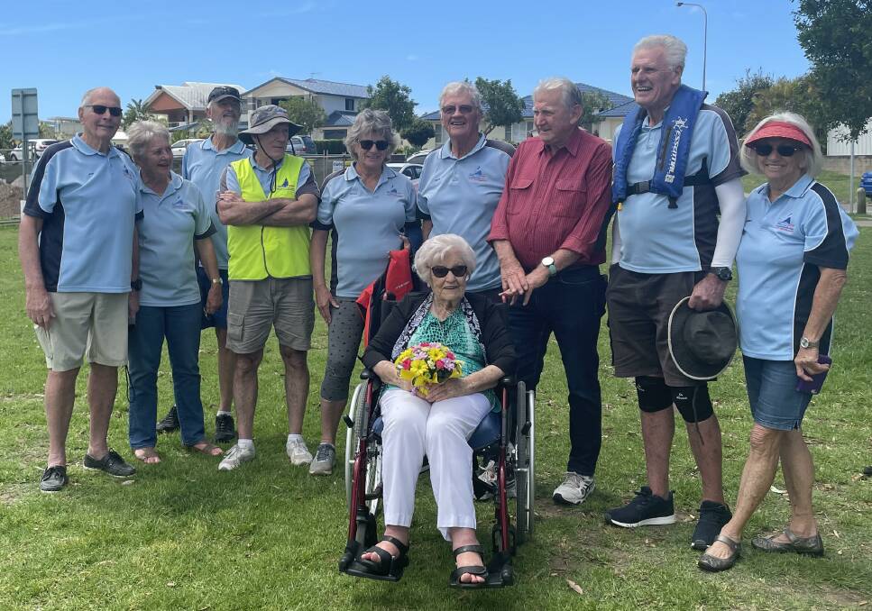 Sailability Port Macquarie volunteers greet 100-year-old Ohna Milanovic at McInherney Park.