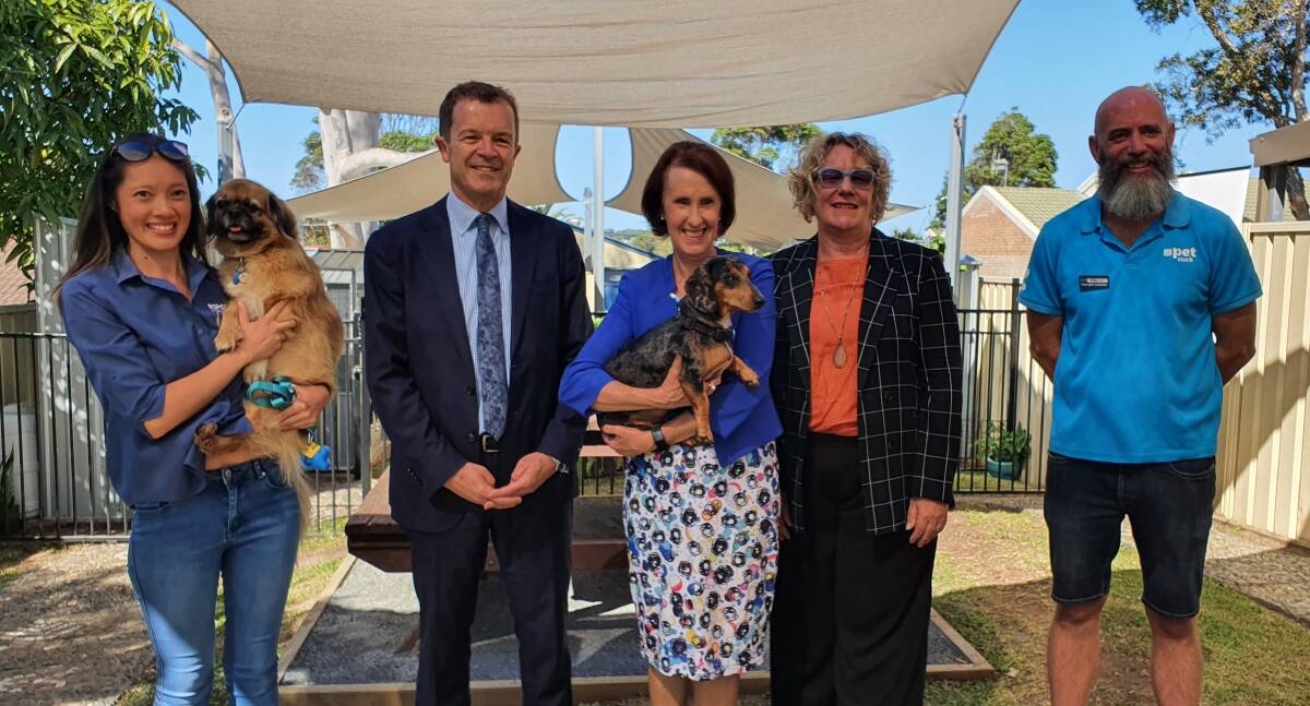 New program: Sandra Ma from RSPCA NSW, NSW Attorney General and Minister for the Prevention of Domestic Violence Mark Speakman, Port Macquarie MP Leslie Williams, Liberty CEO Kelly Lamb, PETstock Port Macquarie franchisee Phill Edwards and their furry friends at the launch of the Safe Pets program.