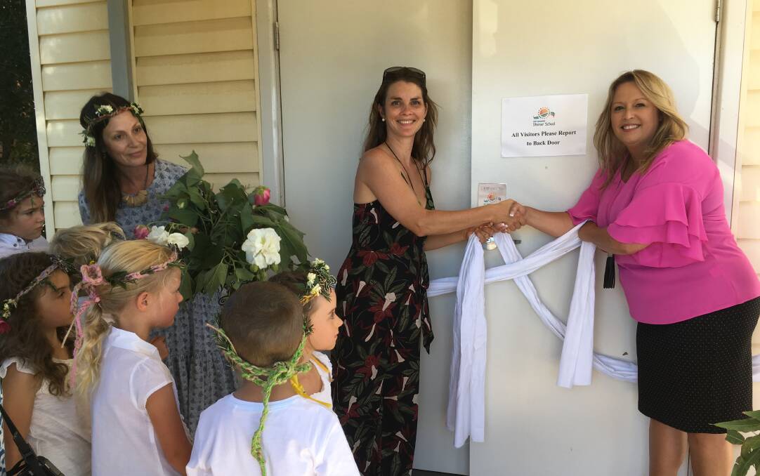 New beginnings: Mayor Peta Pinson (right) congratulates Port Macquarie Steiner president Alanna Alfaro at the Port Macquarie Steiner School's official opening as teacher Kristy Barry and the students look on.