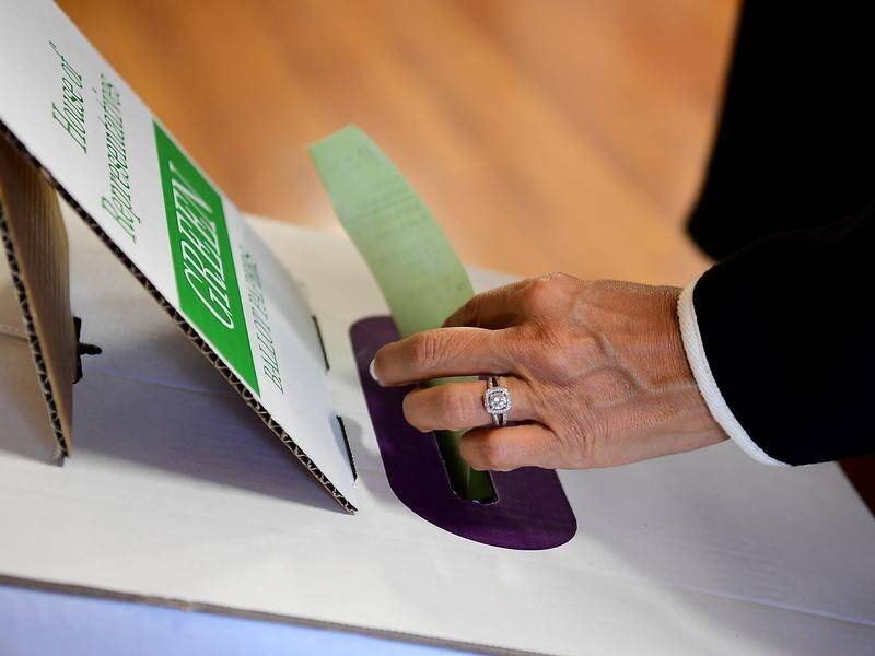 The federal election contest remains close in three lower house seats as vote counting continues.
