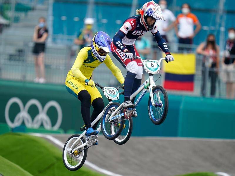 Saya Sakakibara (left) has been stretchered off the track after crashing in the Olympic BMX semis.