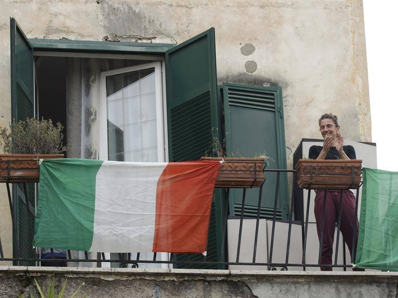 Many Italians have joined their neighbours in communal singing by stepping onto their balconies.