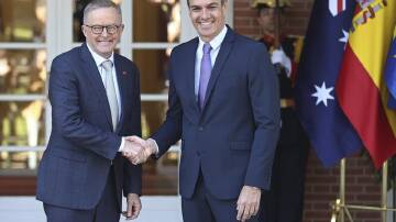 Anthony Albanese shakes hands with Spain's Premier Pedro Sanchez ahead of a NATO summit.