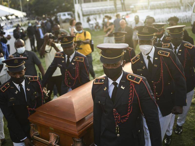 Police carried the coffin of slain Haitian leader Jovenel Moise at the start of his funeral.
