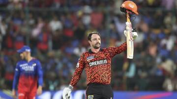 Travis Head celebrates his blistering 39-ball century for Sunrisers Hyderabad in Bengaluru. (AP PHOTO)
