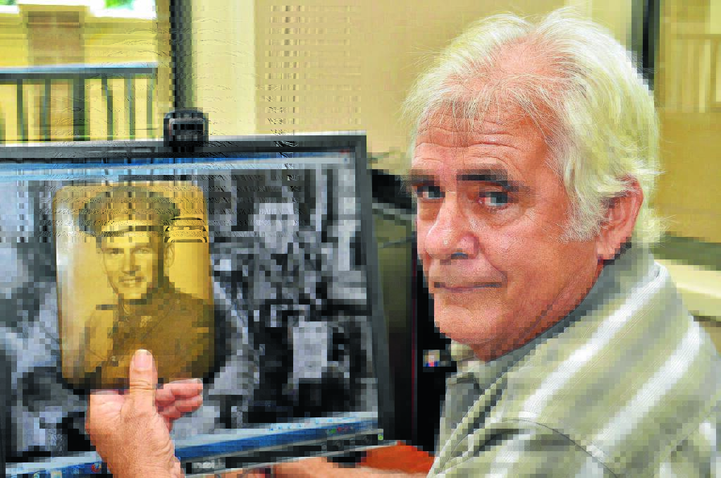 Family history: Brett Dolsen with old photos of his father and grandfather.